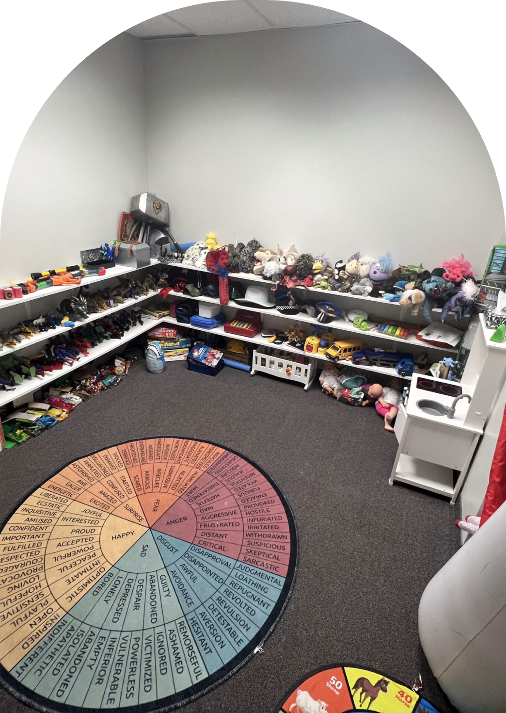Therapy toys and supplies organized on shelves at Stone Silo Counselling & Wellness.