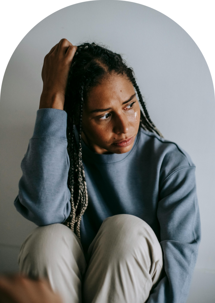 Young woman in distress during therapy session at Stone Silo Wellness.
