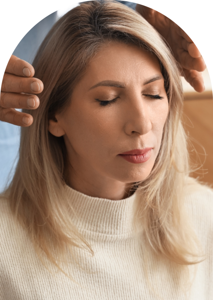 Woman receiving a calming massage for wellness and stress relief.